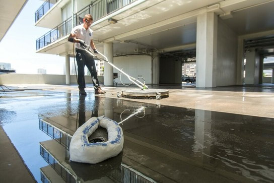 soft washing power cleaning of concrete commercial flooring