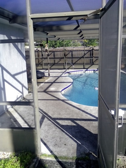 before photo of black pool deck surface cleaned by power washing