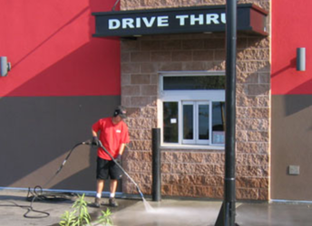 pressure washing a commercial fast food establishment drive thru