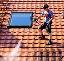 window cleaning company working on windows in roof